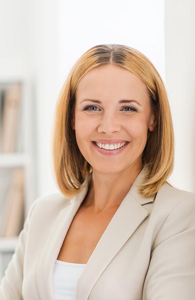Woman Smiling in Suit